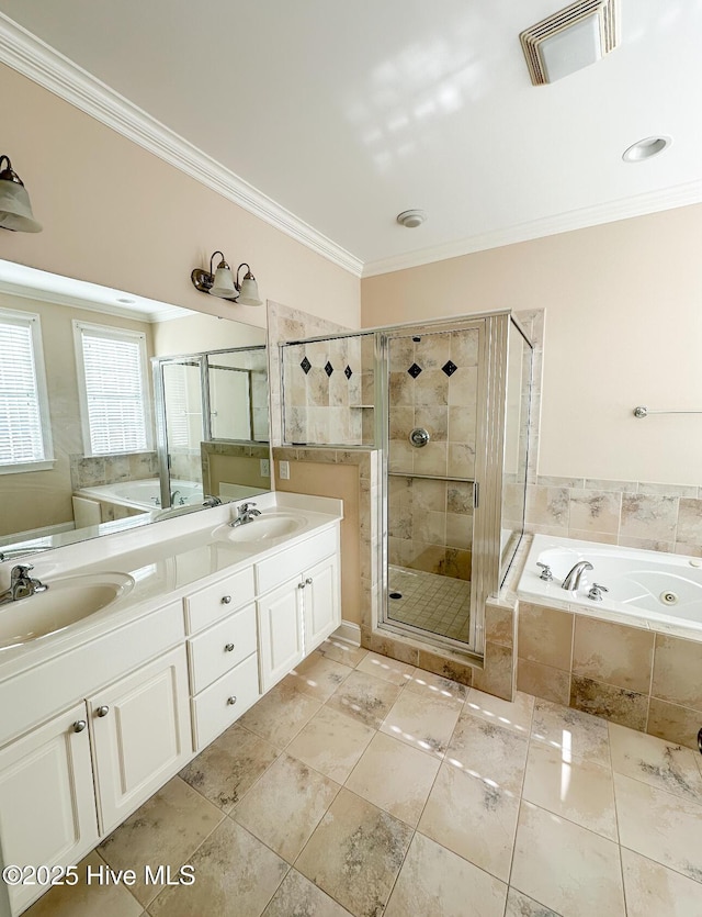 bathroom featuring ornamental molding, shower with separate bathtub, and vanity