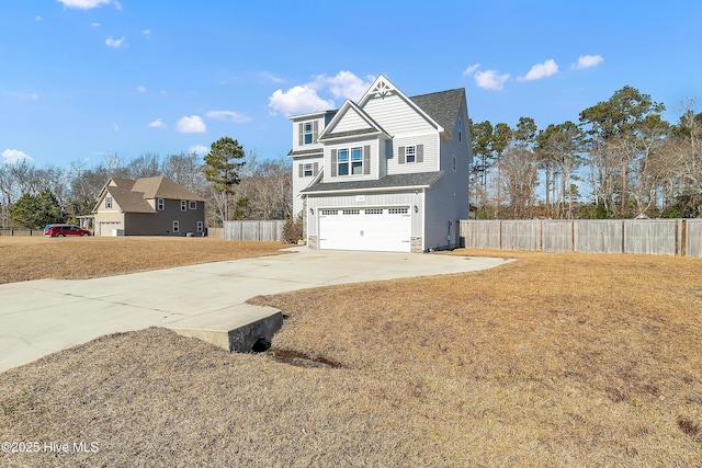 view of front of property featuring a garage and a front yard