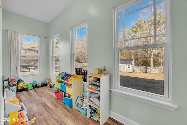 rec room with hardwood / wood-style flooring