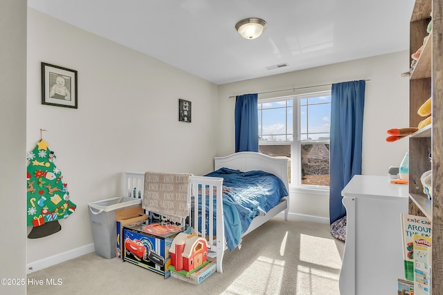 bedroom featuring light colored carpet