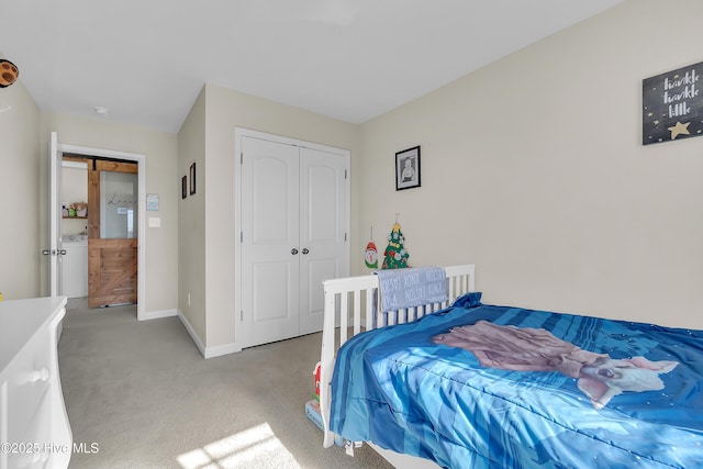 carpeted bedroom with a closet