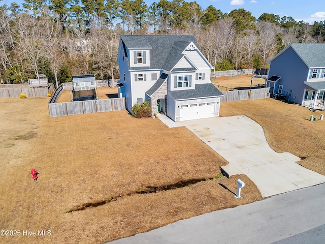 front facade with a garage and a front yard