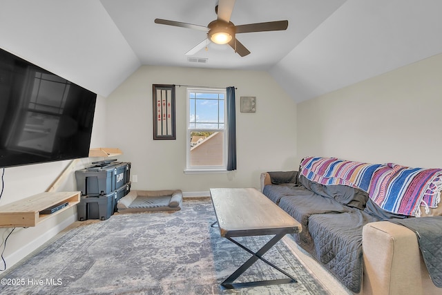 living room with ceiling fan and vaulted ceiling