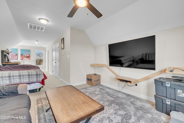 bedroom featuring lofted ceiling, light carpet, and ceiling fan