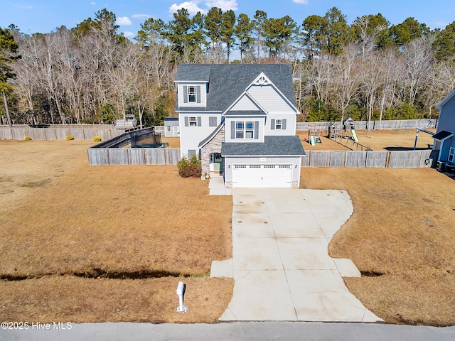 view of front facade featuring a garage and a front yard