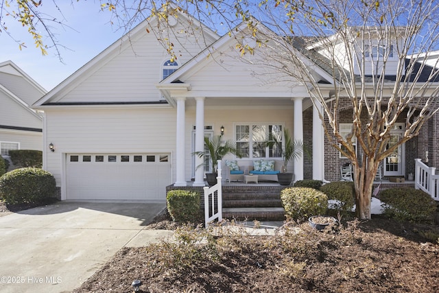 view of front facade featuring a porch and a garage