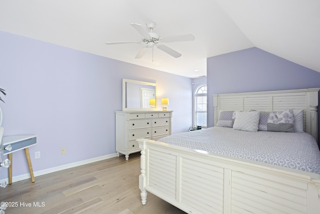 bedroom featuring ceiling fan, lofted ceiling, and light wood-type flooring