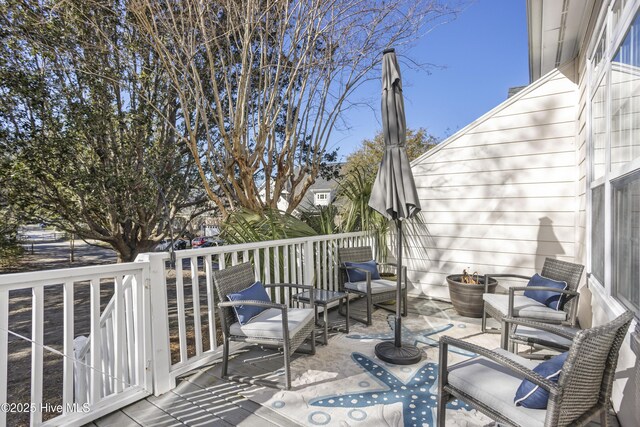 wooden deck featuring outdoor lounge area