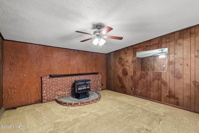 unfurnished living room with light carpet and wood walls