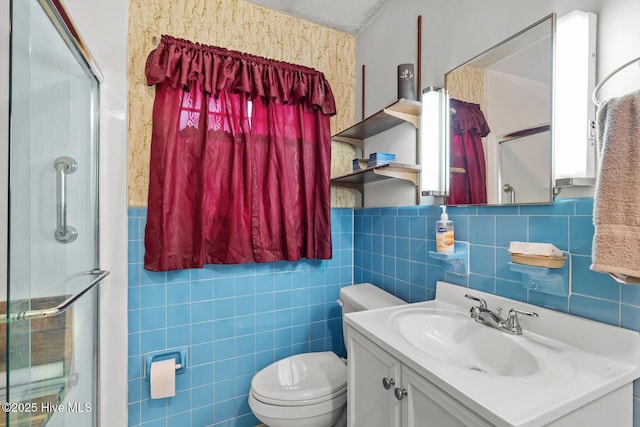 bathroom with vanity, tile walls, an enclosed shower, and toilet