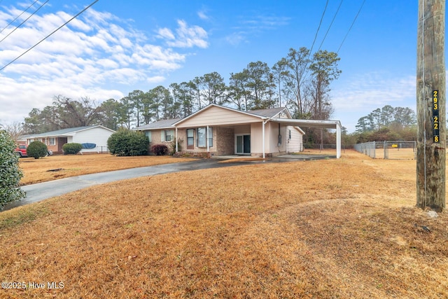 single story home with a carport and a front yard