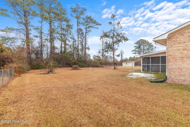 view of yard featuring a sunroom