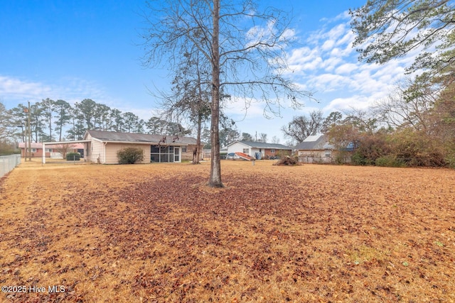 view of yard featuring a sunroom