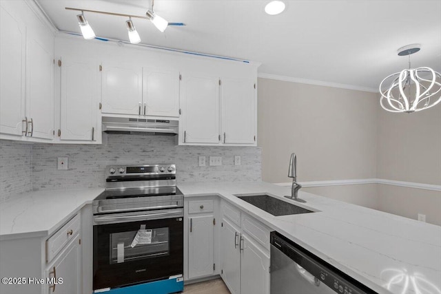 kitchen with sink, pendant lighting, stainless steel appliances, decorative backsplash, and white cabinets