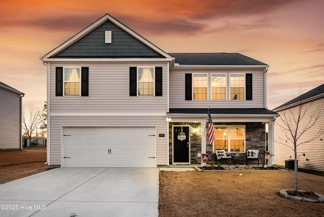 front of property with a garage and central AC unit