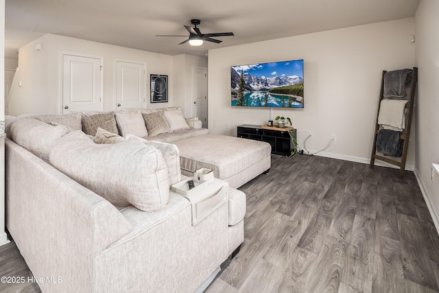 living room with hardwood / wood-style floors and ceiling fan