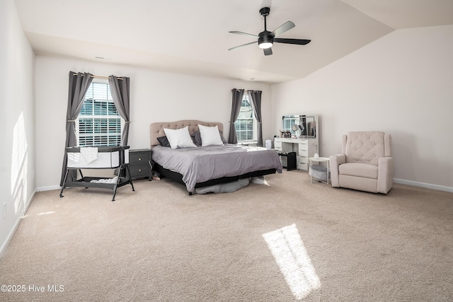 carpeted bedroom with ceiling fan and lofted ceiling