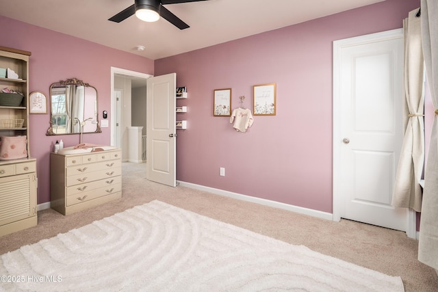 carpeted bedroom featuring ceiling fan