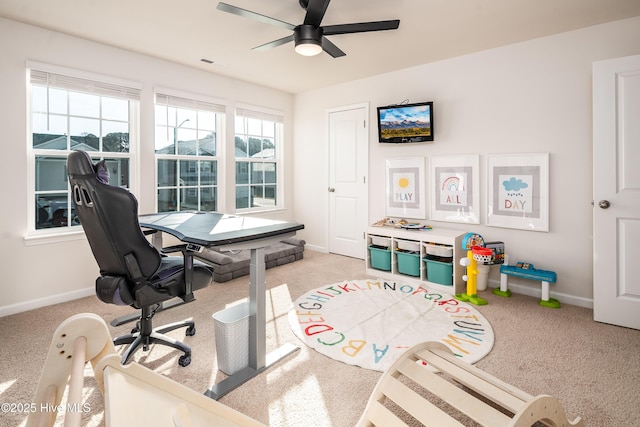 office area with ceiling fan and light colored carpet