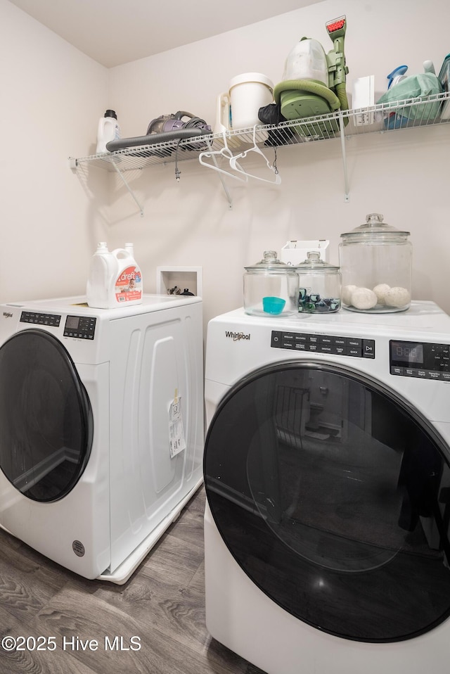 washroom featuring separate washer and dryer and dark hardwood / wood-style flooring