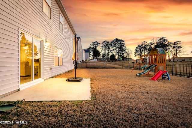 exterior space featuring a playground and a patio area