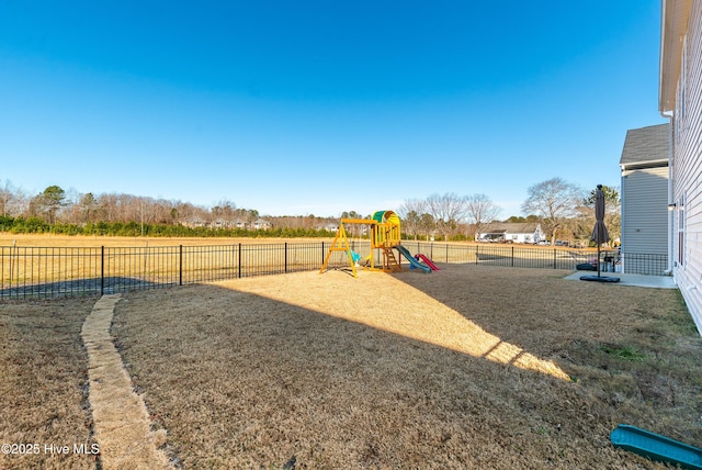 view of playground with a lawn