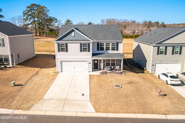 front of property featuring a porch and a garage