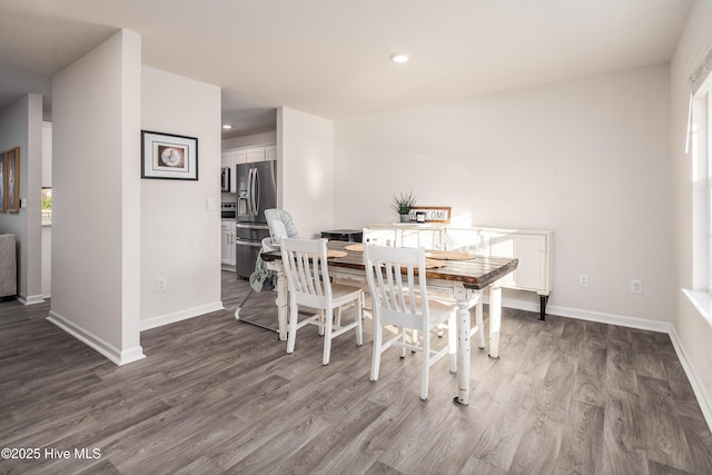 dining area with hardwood / wood-style floors