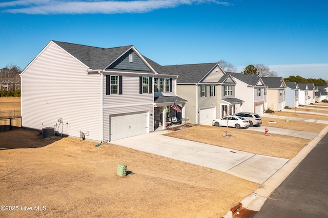 view of front of home featuring a garage, a front lawn, and central air condition unit