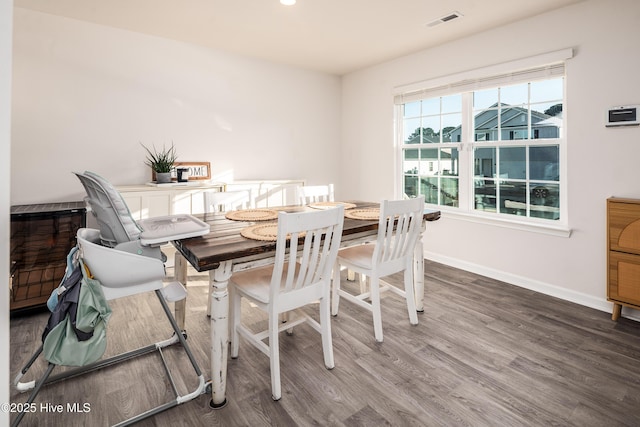 dining space featuring hardwood / wood-style floors