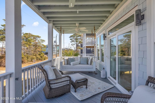 wooden terrace featuring outdoor lounge area