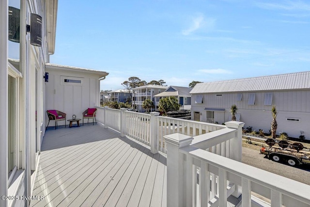 wooden deck with a residential view