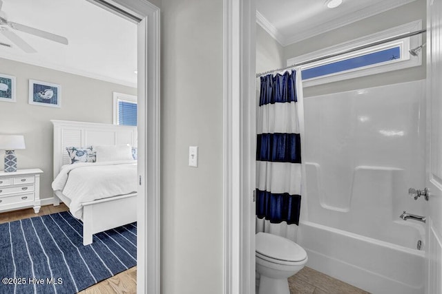 bathroom featuring toilet, wood finished floors, a ceiling fan, ornamental molding, and ensuite bath