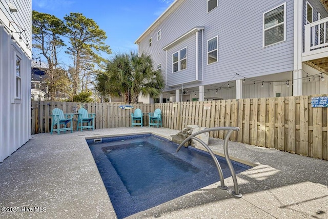 view of pool with a patio area, a fenced backyard, and a fenced in pool