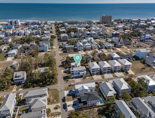 birds eye view of property with a water view and a residential view