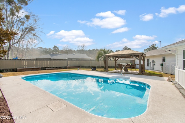 view of swimming pool featuring a fenced in pool, a fenced backyard, a patio, and a gazebo