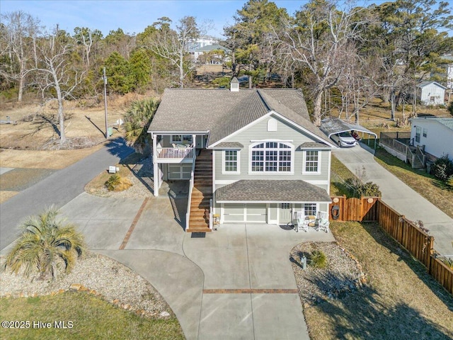 view of front of house with a garage and a balcony