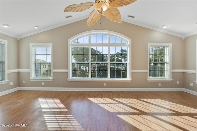 unfurnished room with crown molding, lofted ceiling, and light wood-type flooring