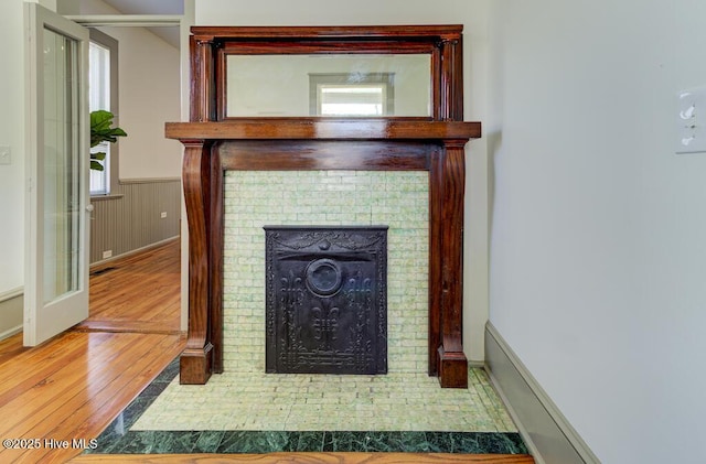 room details with wood-type flooring and a fireplace