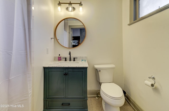 bathroom featuring vanity, curtained shower, and toilet