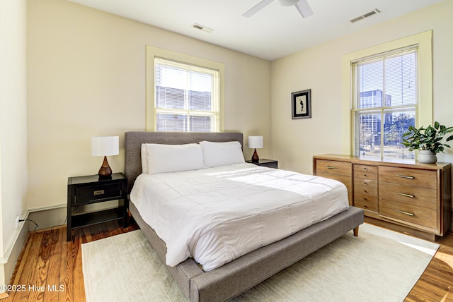 bedroom featuring dark hardwood / wood-style floors and ceiling fan