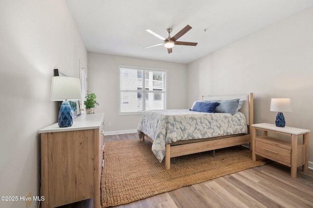 bedroom with hardwood / wood-style flooring and ceiling fan