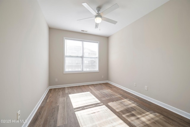 spare room with ceiling fan and hardwood / wood-style floors