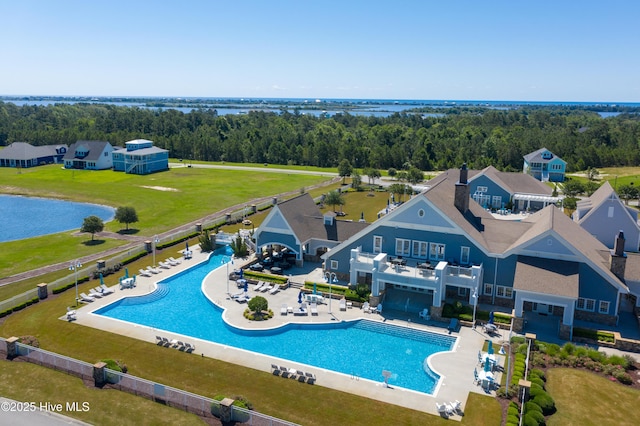 view of swimming pool featuring a water view