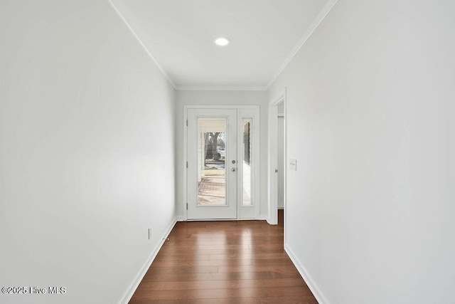 entryway featuring crown molding and dark hardwood / wood-style flooring