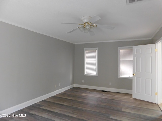 unfurnished room with ornamental molding, dark wood-type flooring, and ceiling fan