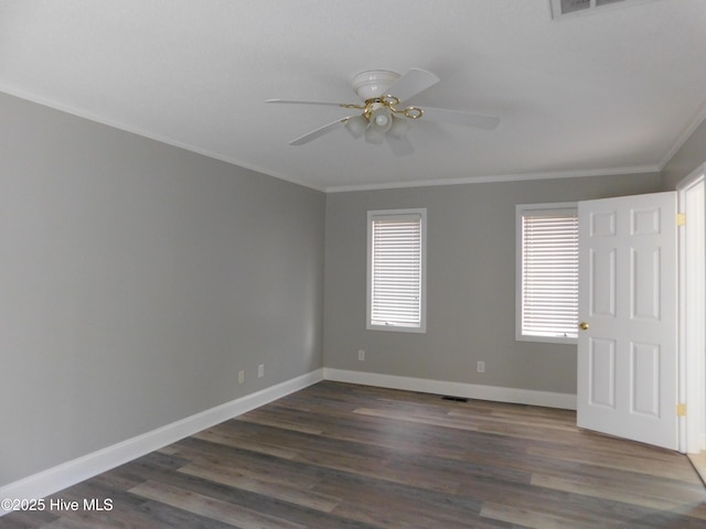 empty room with dark wood-style floors, ceiling fan, and ornamental molding