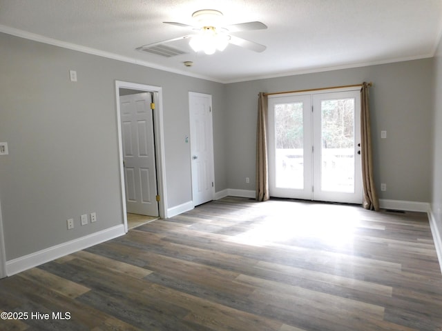 unfurnished room with dark wood-type flooring, ceiling fan, ornamental molding, and a textured ceiling