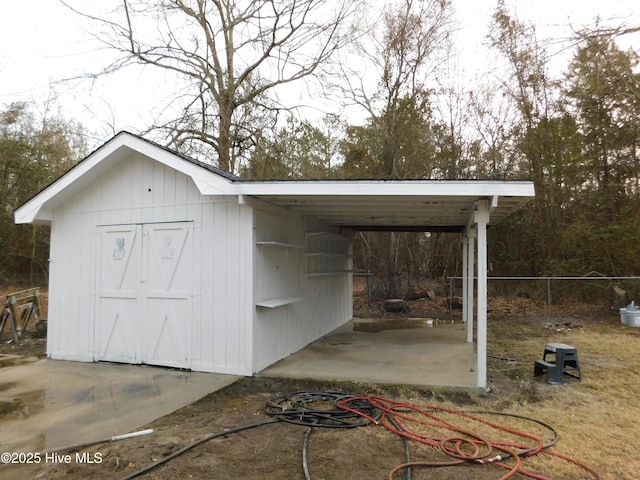 view of outdoor structure with an outdoor structure and fence