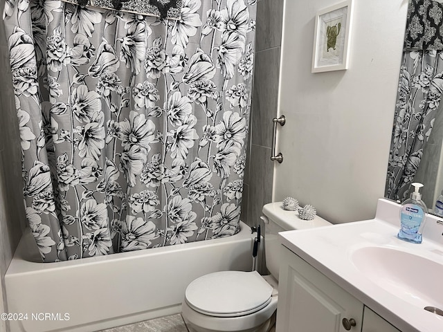 full bathroom with shower / bathtub combination with curtain, vanity, and toilet